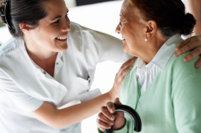 caregiver smiling at the senior woman