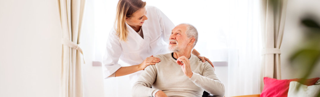 caregiver taking care of the old man