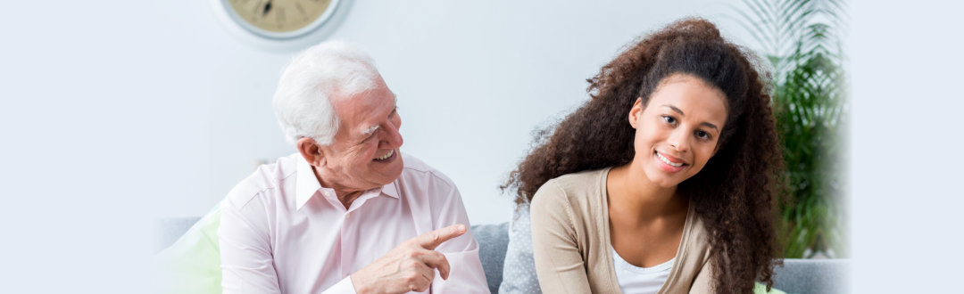 old man laughing with the caregiver